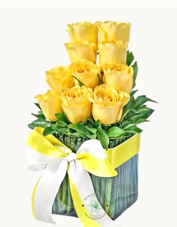 Vase of Yellow Roses with Green Leaf